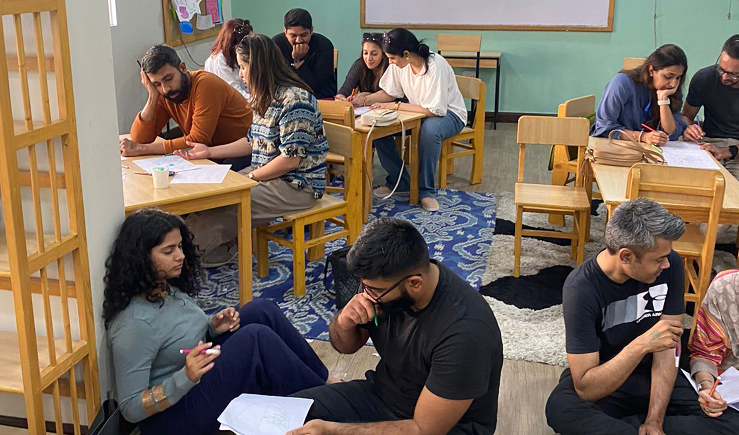 Couples engage in activities during a play therapy workshop session conducted by Ramsha Nassr on the opening day of Karachi Wellness Festival 2023 at Veritas Learning Circle in Karachi, Pakistan, on February 4, 2023. (Photo courtesy: Ramsha Nassr)