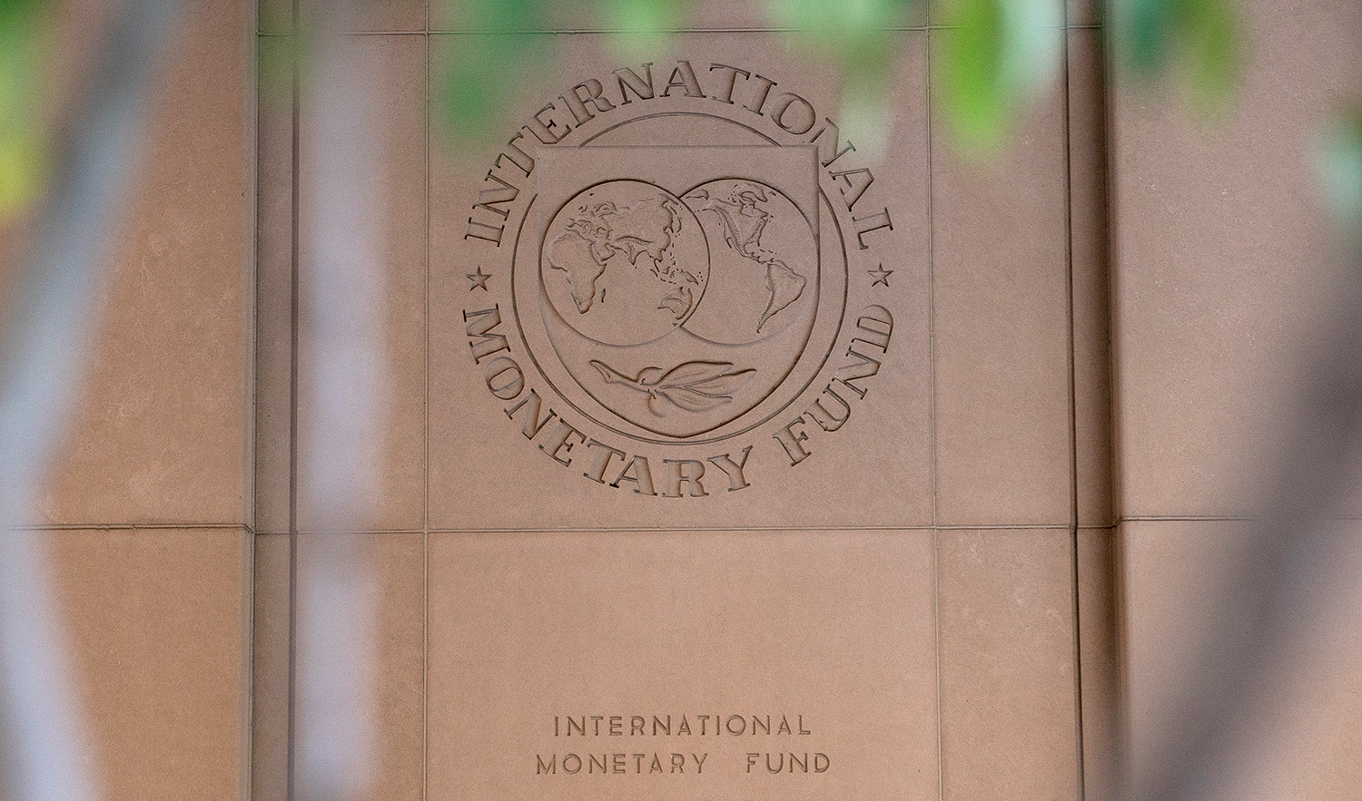 The International Monetary Fund (IMF) logo is displayed outside its headquarters in Washington DC, United States, on October 8, 2022. (AFP/File)