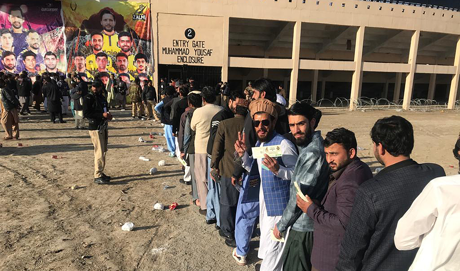 Excited fans, with tickets in hand, line up in hundreds outside the Muhammad Yousaf enclosure at the Nawab Akbar Bugti Stadium in Quetta on February 5, 2023. (Photo by Saadullah Akhter)