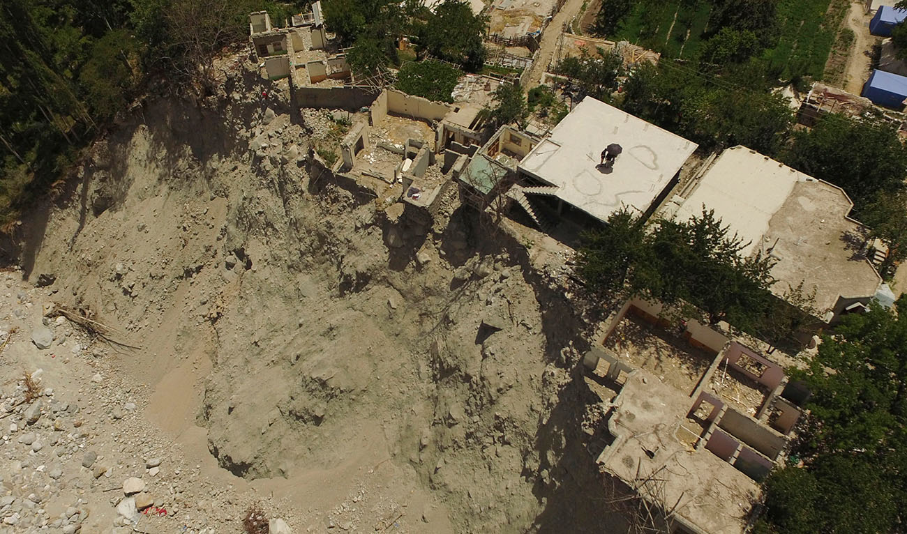 This aerial picture taken on June 9, 2022, shows collapsed and damaged houses caused by a lake outburst because of a melting glacier, in Hassanabad village of Pakistan's Gilgit-Baltistan region. (Photo courtesy: AFP)
