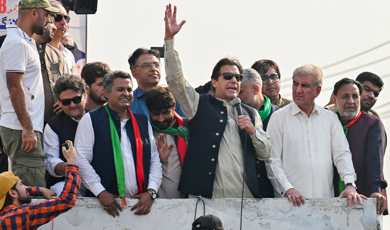 Former Pakistan prime minister Imran Khan (C) addresses his supporters during an anti-government long march towards Islamabad to demand early elections, in Lahore on October 29, 2022. (AFP/File)