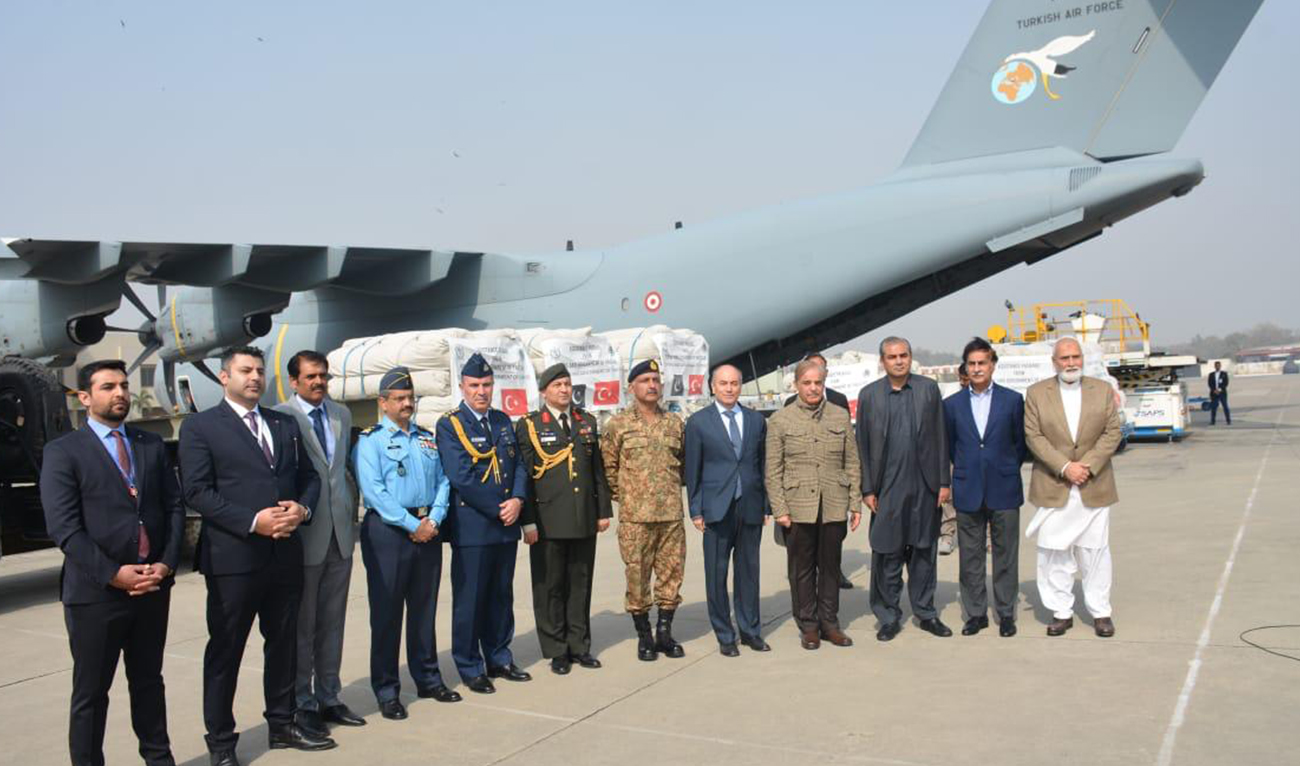 Prime Minister Muhammad Shehbaz Sharif in a group photo with Turkish Consul General Emir Ozbay & others on the occasion of seeing off a cargo plane carrying relief goods for the earthquake victims of Turkiye in Lahore on February 10, 2023. (Photo courtesy: @PakPMO/Twitter)