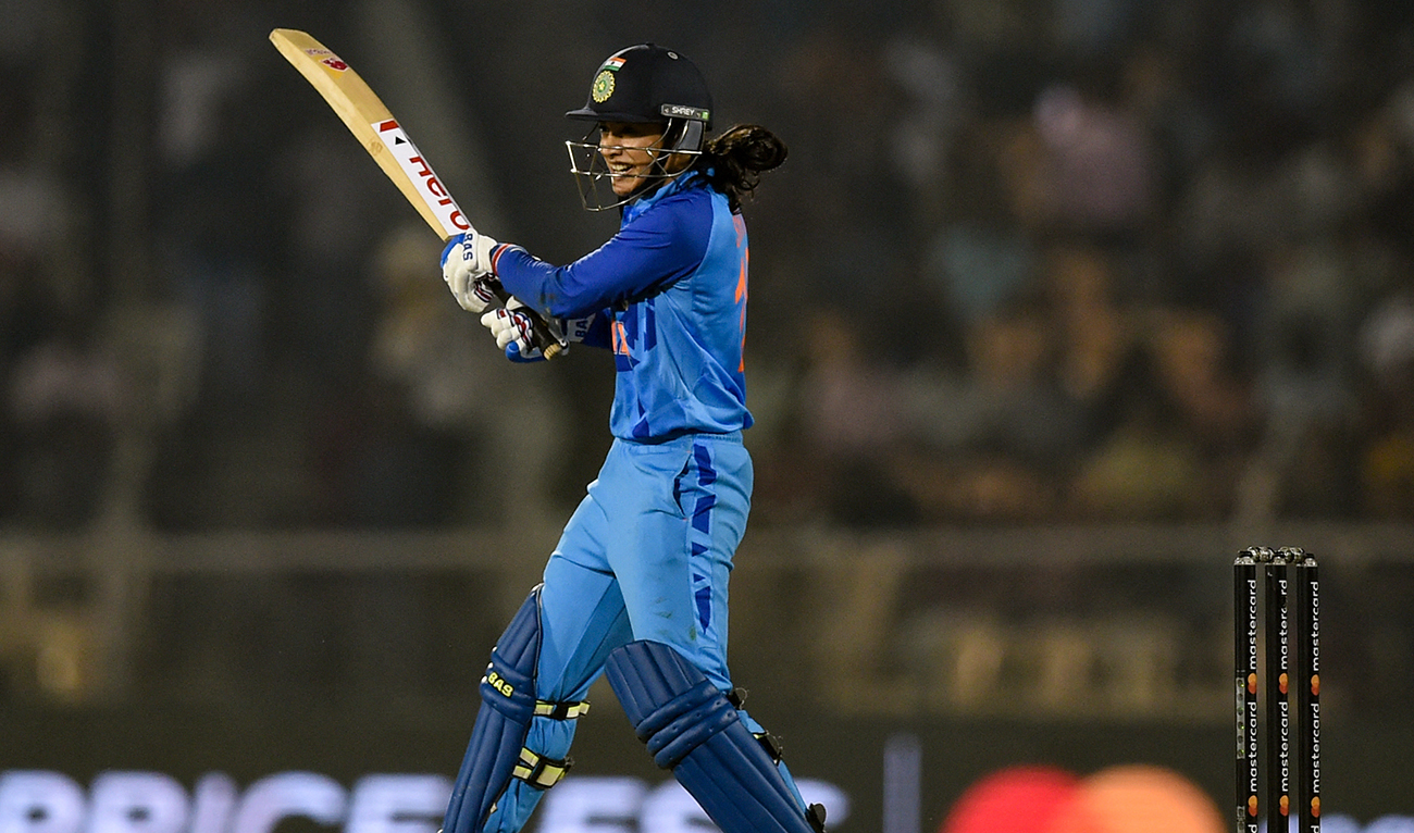 In this file photo taken on December 17, 2022, India's Smriti Mandhana plays a shot during the fourth women’s T20 cricket match between India and Australia at the Cricket Club of India stadium in Mumbai. (Photo courtesy: AFP/File)