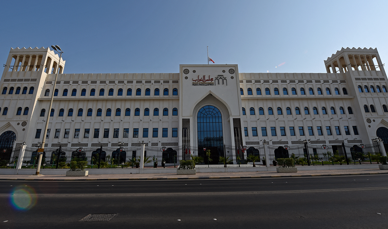 The Bahraini flag flies at half-mast above Bahrain's National Assembly building in the capital Manama on September 9, 2022. (AFP/FILE)