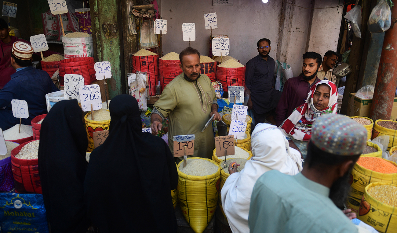 People buy rice at a market in Karachi on February 3, 2023. (Photo courtesy: AFP)