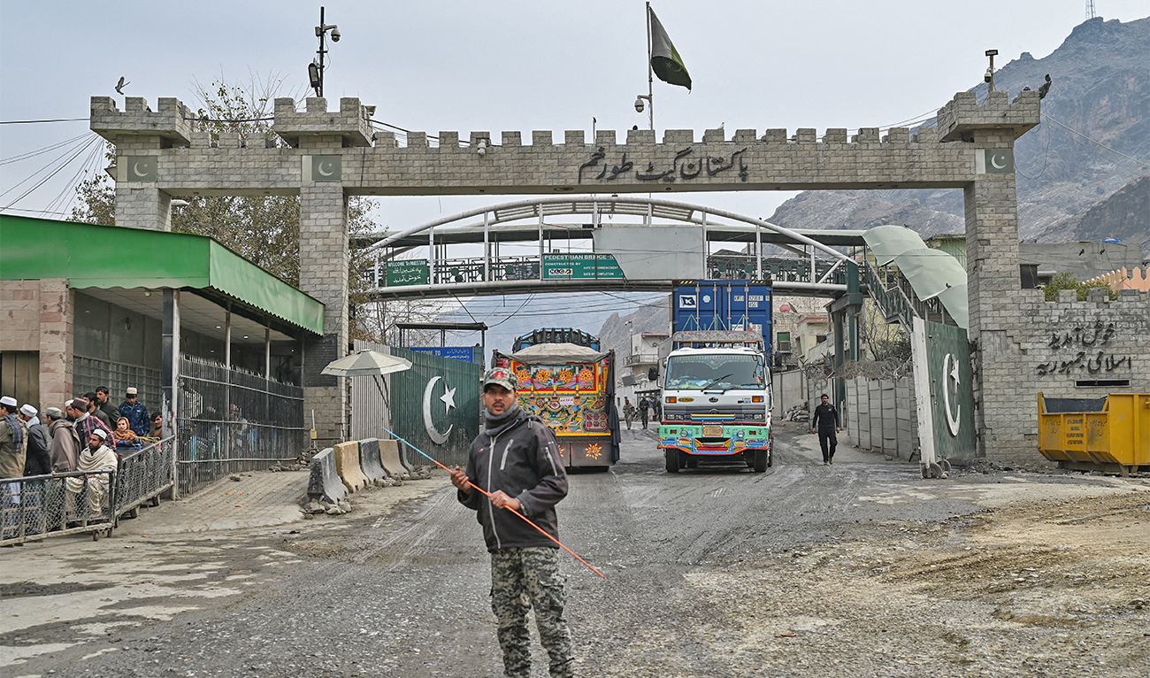 In this picture taken on February 2, 2023, a Pakistan border policeman is pictured from the zero point Torkham border crossing between Afghanistan and Pakistan, in Nangarhar province. (AFP/File)