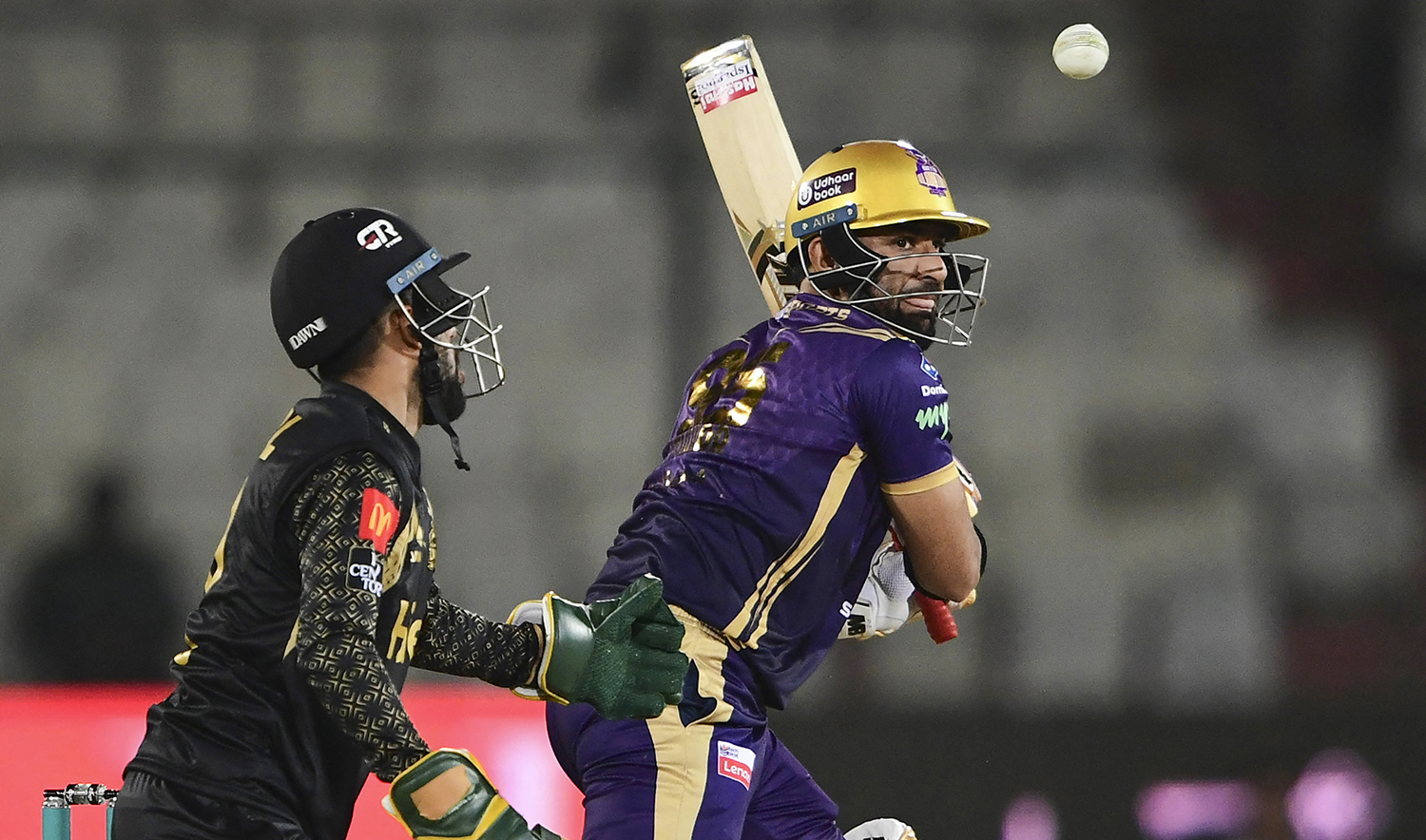 Quetta Gladiators' Iftekhar Ahmed, right, plays a shot during the Pakistan Super League (PSL) T20 cricket match between Peshawar Zalmi and Quetta Gladiators at the National Stadium in Karachi on February 20, 2023. (AFP)