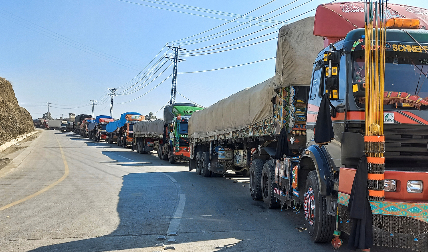 Trucks loaded with supplies to leave for Afghanistan, are seen stranded after Taliban authorities have closed the main border crossing in Torkham, Pakistan on February 21, 2023. (REUTERS)