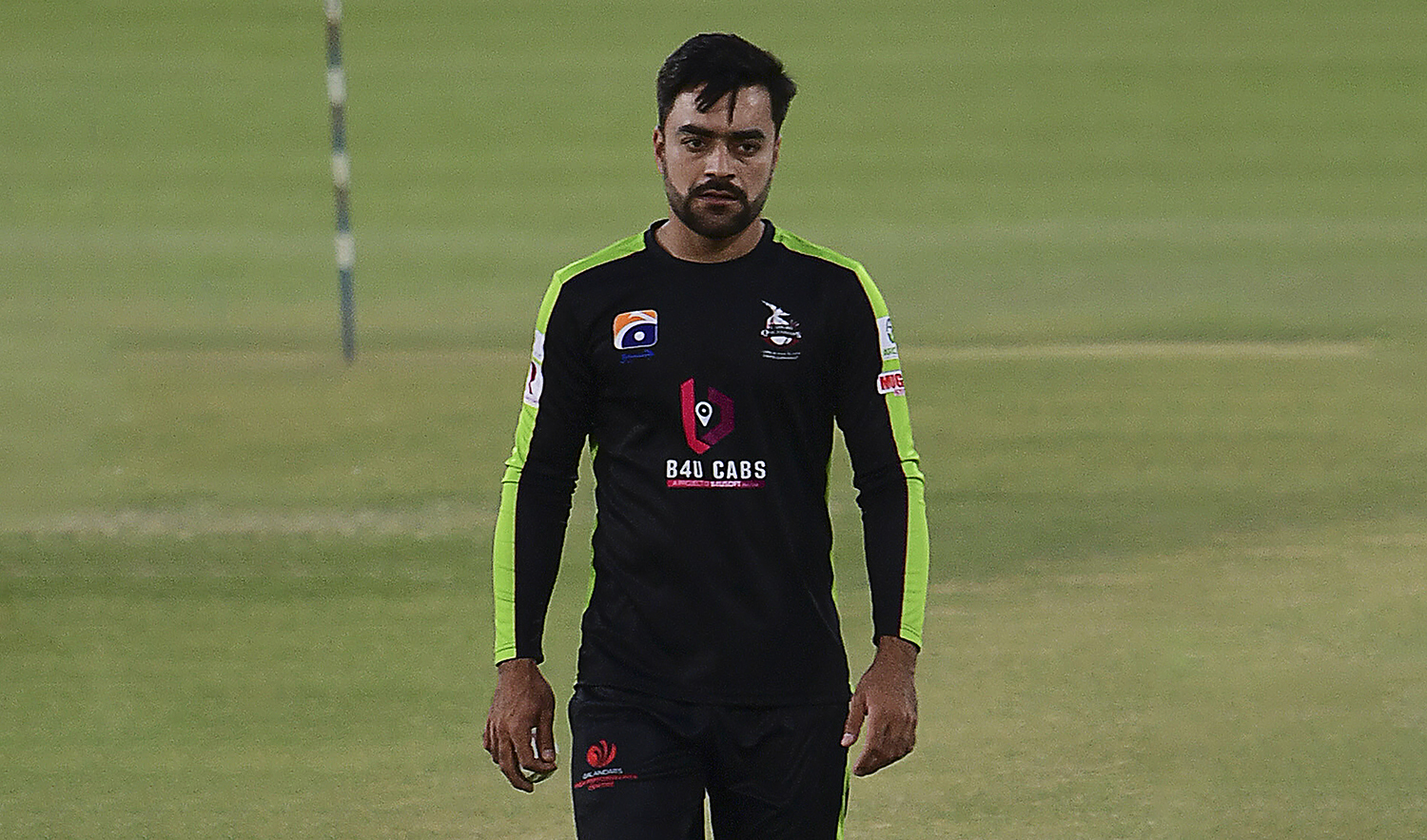 Lahore Qalandars' Rashid Khan arrives for practice before the start of the Pakistan Super League (PSL) T20 cricket match against Quetta Gladiators at the National Stadium in Karachi on February 22, 2021. (AFP)