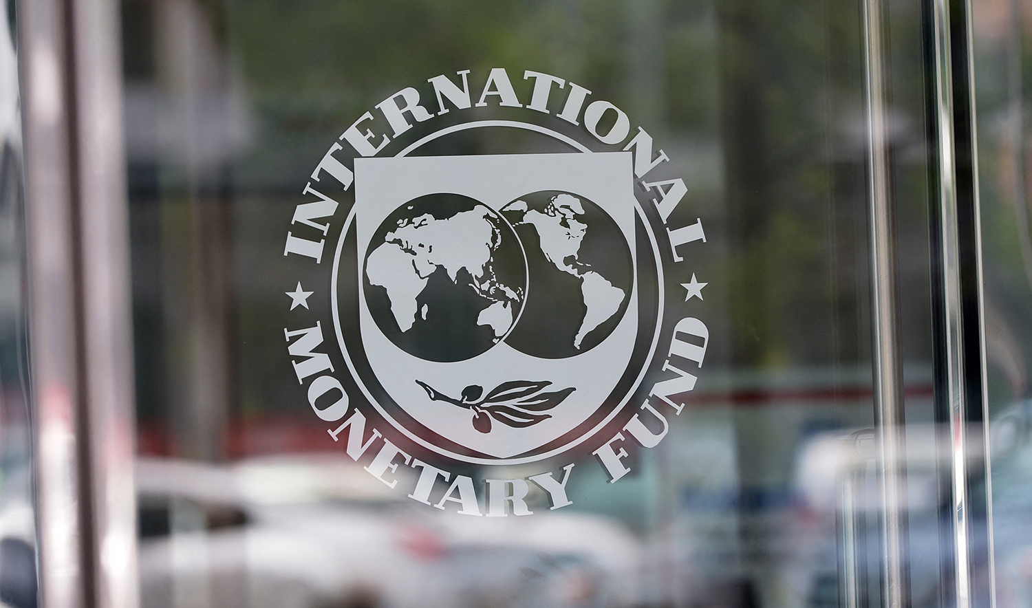 The seal of the International Monetary Fund is seen at the headquarters building in Washington, DC on July 5, 2015. (AFP/File)
