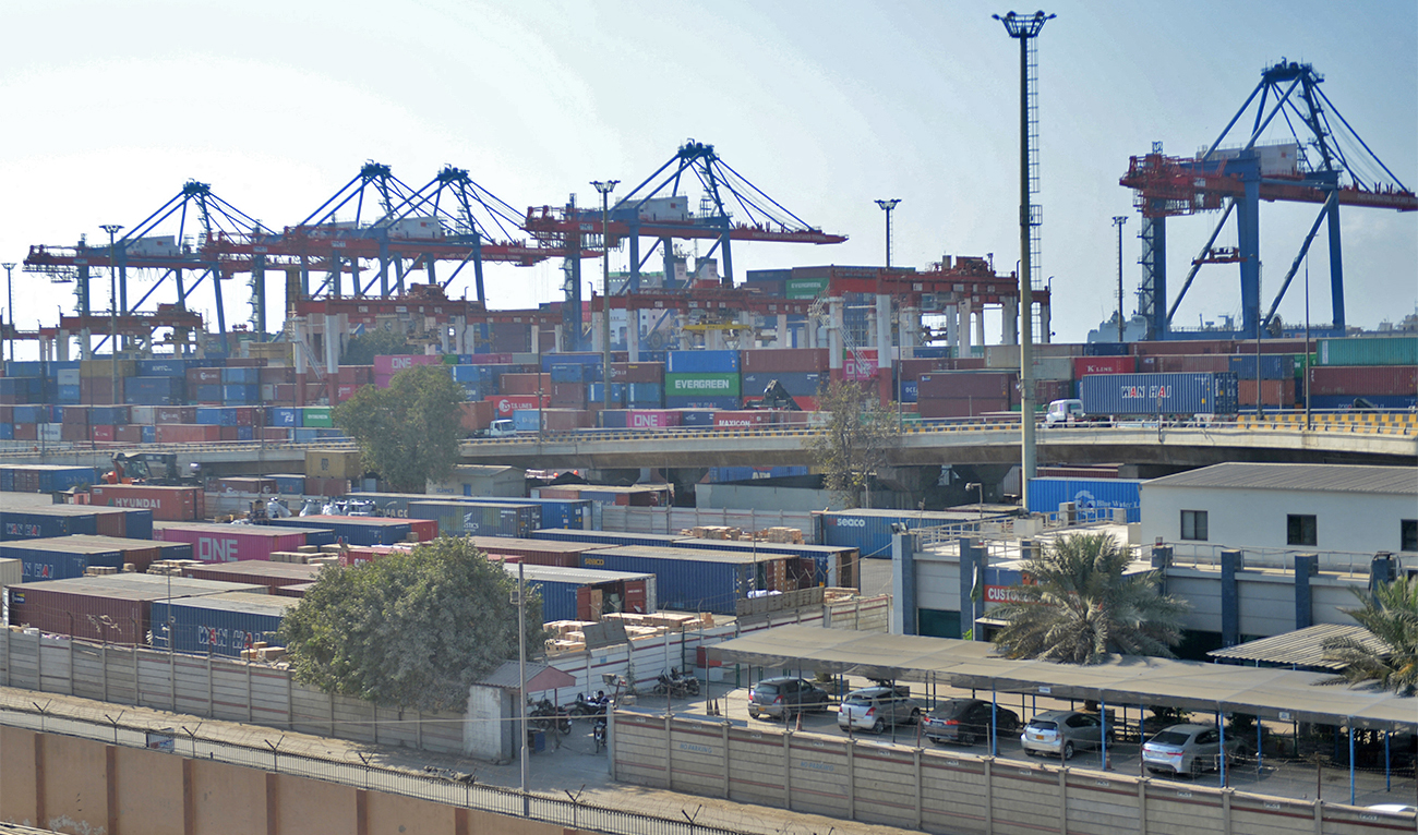 In this picture taken on January 11, 2023, shipping containers are seen placed under cranes at the Karachi sea port. (AFP/File)