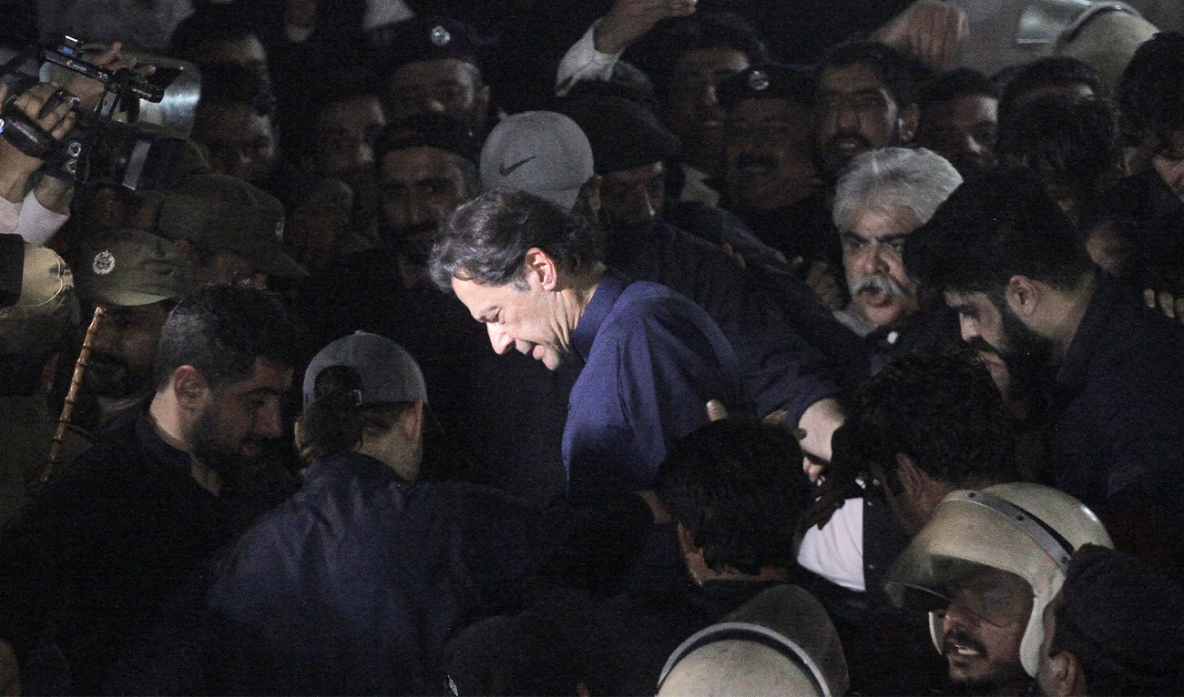 Pakistan's former Prime Minister, Imran Khan, along with his supporters walks as he leaves the district High Court in Lahore, Pakistan on February 20, 2023. (REUTERS/File)