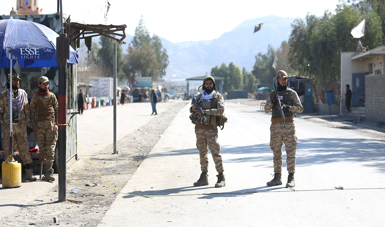 Taliban security personnel stand guard along a road after gunfire erupted between Afghanistan and Pakistan border forces at Torkham border crossing between Afghanistan and Pakistan, in Nangarhar province on February 20, 2023. (AFP/FILE)