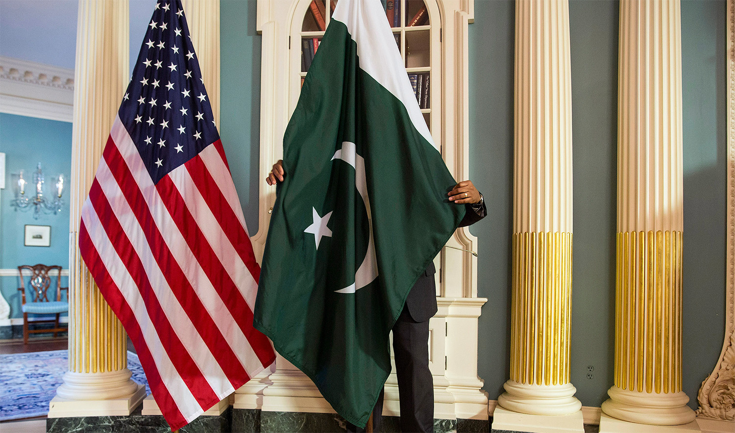 This representational file photo shows a man adjusting Pakistan's national flag at the State Department in Washington DC on February 19, 2015. (REUTERS/File)