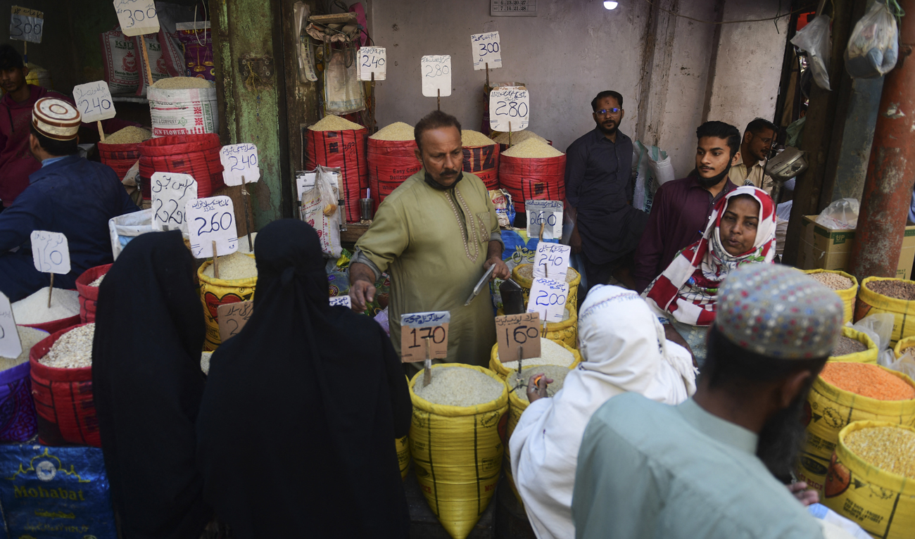 People buy rice at a market in Karachi on February 3, 2023. (Photo courtesy: AFP/File)