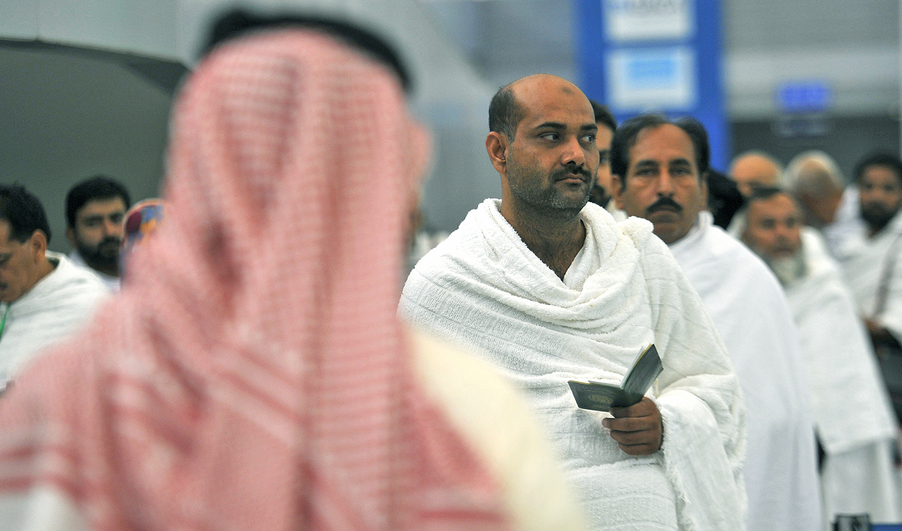 In this file photo taken on July 24, 2017, Pakistani Muslims wait to be checked by security as the first pilgrims for the annual Hajj pilgrimage arrive in Jeddah. (Photo courtesy: AFP/File)