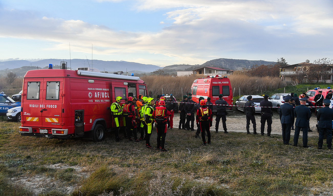 Divers of the Italian Coast Guards, rescuers from the Firefighters Corps. and police officers gather at an Advanced command Post set near the beach of Steccato di Cutro, south of Crotone, after a migrants' boat sank off Italy's southern Calabria region. (Photo courtesy: AFP)
