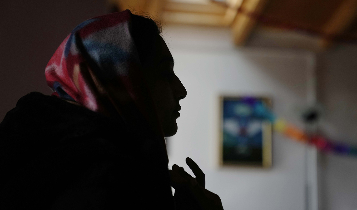 Pakistani-born, Iram Aslam, 29, talks during an interview with The Associated Press in a social activities center in Guastalla, northern Italy, on February 11, 2023. (AP)