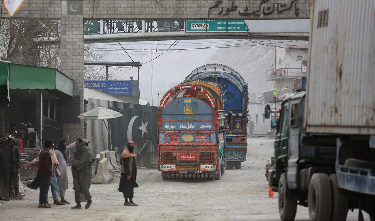 Goods carrier trucks cross into Pakistan at the zero point Torkham border crossing between Afghanistan and Pakistan, in Nangarhar province on February 25, 2023. (Photo courtesy: AFP)
