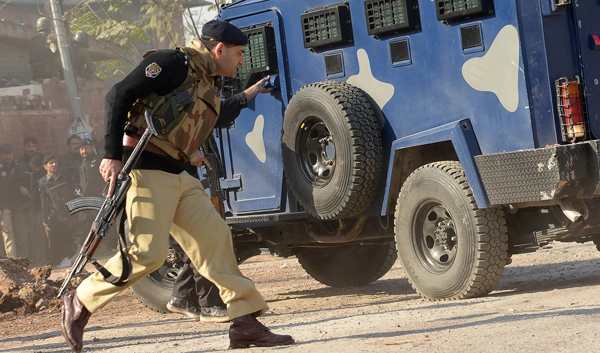 Pakistani security personnel take position outside an Agriculture Training Institute after an attack by Taliban militants in Peshawar on December 1, 2017. (AFP/File)