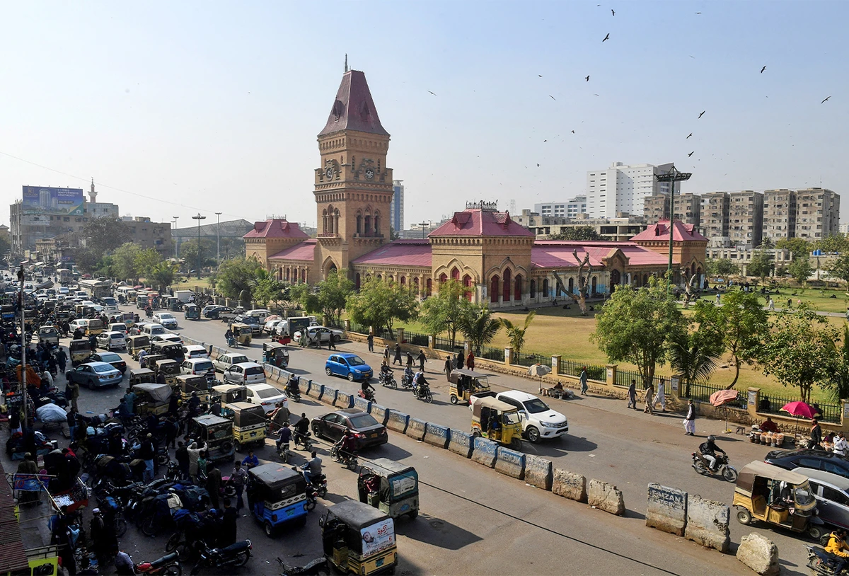 This picture taken on January 30, 2023 shows commuters passing Impress Market in Pakistan's port city of Karachi. (AFP/File)