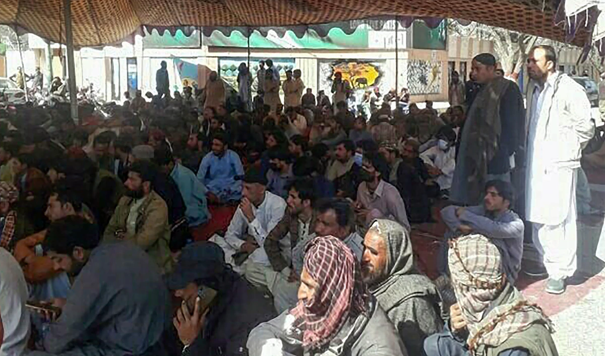 This photograph shared on social media on February 22, 2023, shows protesters gathered in front of the Chief Minister House in the Quetta city of Pakistan's Balochistan province. (Photo courtesy: @Ijazjournalist3/Twitter)