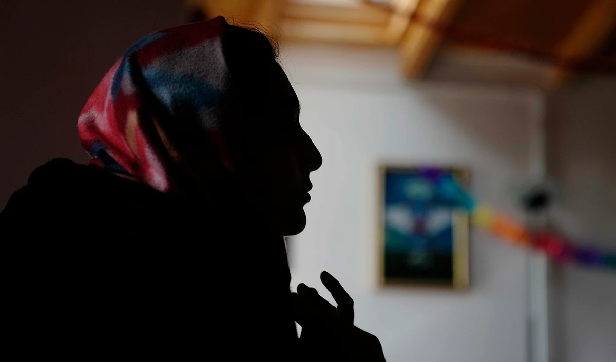 Pakistani-born, Iram Aslam, 29, talks during an interview with The Associated Press in a social activities center in Guastalla, northern Italy, on February 11, 2023. (AP)