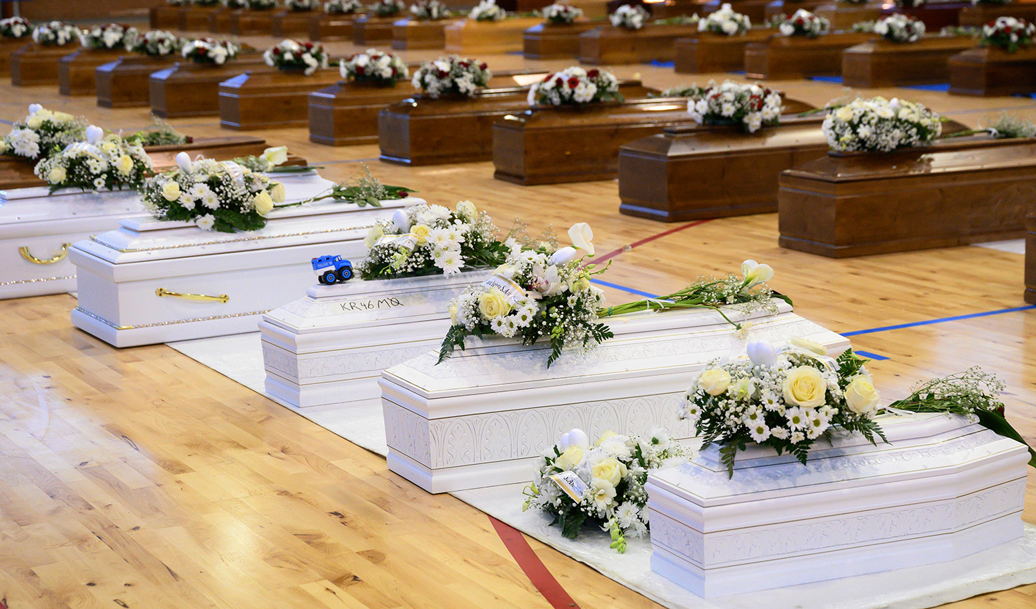 Victims of a migrants boat shipwreck lay in state in a sports centre where they were taken, in Crotone, southern Italy, on February 28, 2023. (AP)