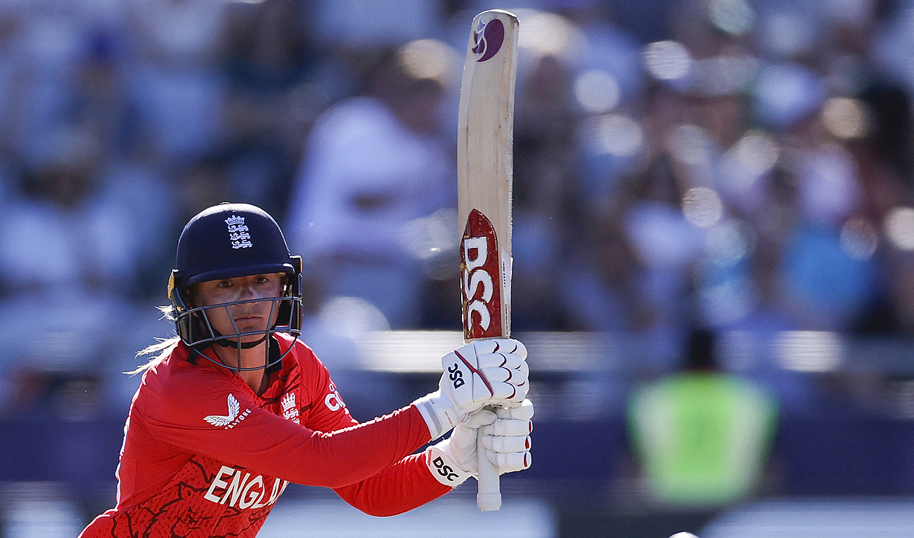 This photo, taken on February 24, 2023, shows England's Danni Wyatt watching the ball after playing a shot during the semi-final T20 women's World Cup cricket match at Newlands Stadium in Cape Town. (Photo courtesy: AFP/File)
