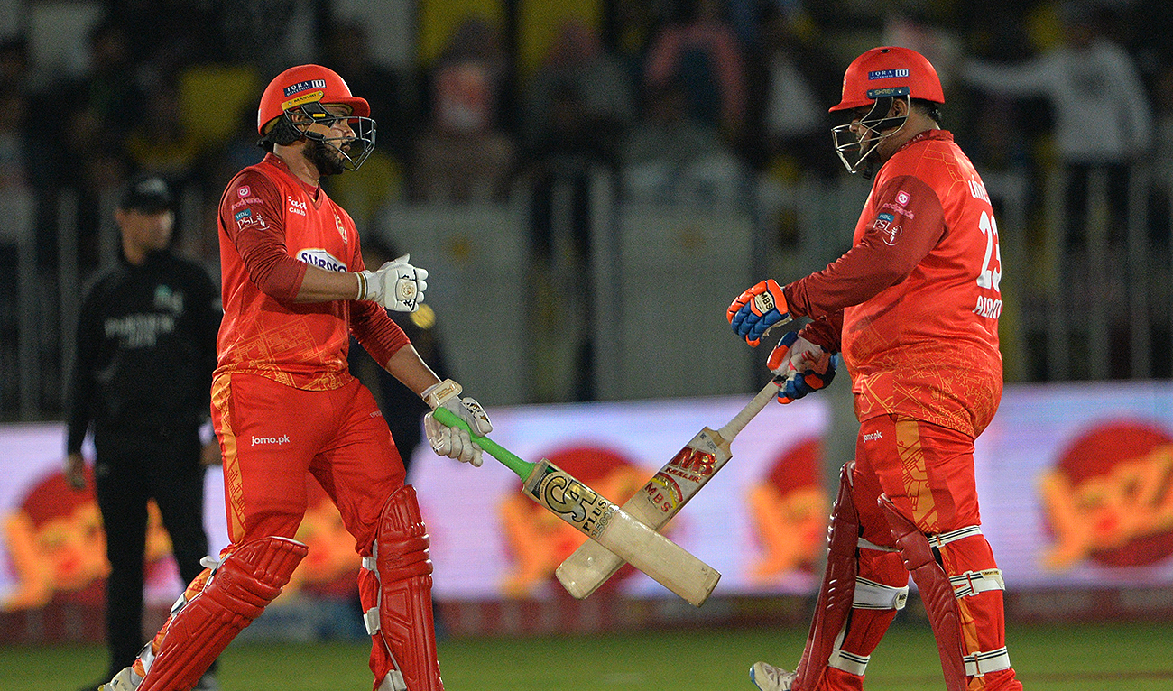 Islamabad United's Azam Khan (R)and Faheem Ashraf (L) celebrate a boundary score during the Pakistan Super League (PSL) Twenty20 cricket match between Islamabad United and Quetta Gladiators at the Rawalpindi Cricket Stadium in Rawalpindi on March 5, 2023. (Photo courtesy: AFP)