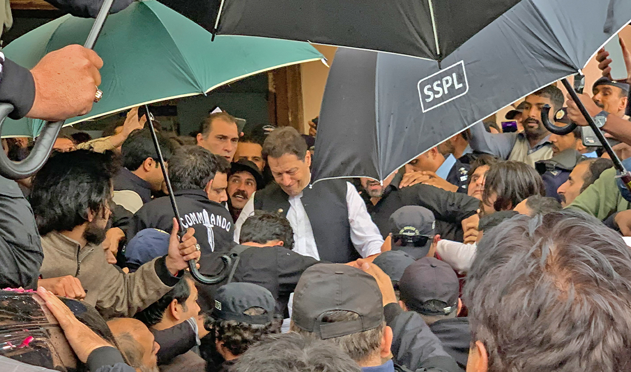 Pakistan's former Prime Minister Imran Khan (C) leaves after appearing at the court in Islamabad on February 28, 2023. (AFP/File)