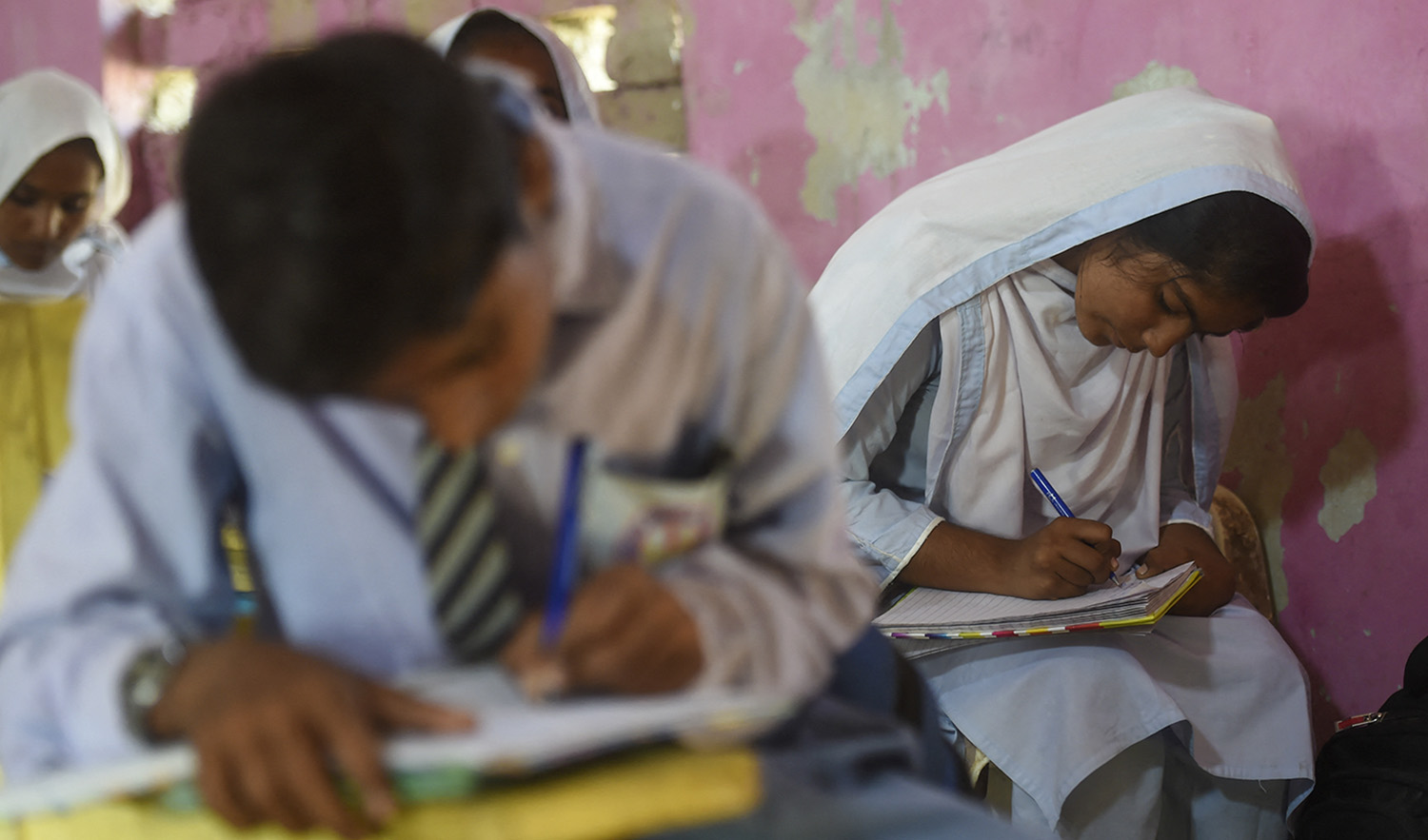 Pakistani students attend a class at a government secondary school in the flood-affected Dadu district of Sindh province on October 28, 2022. (AFP/File)