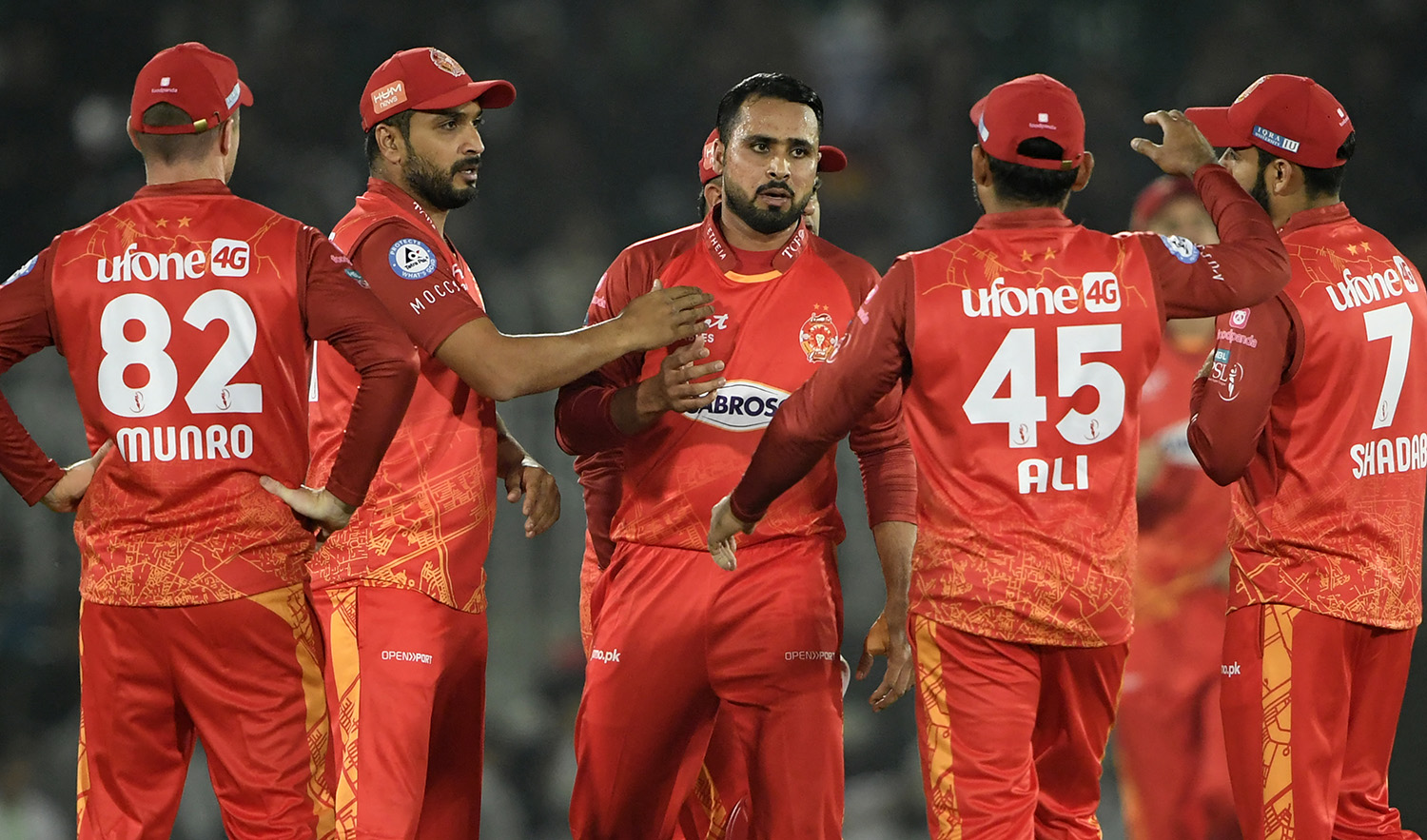 Islamabad United's Faheem Ashraf (C) celebrates with teammates after taking the wicket of Karachi Kings' Shoaib Malik during the Pakistan Super League (PSL) T20 cricket match at the Rawalpindi Cricket Stadium on March 3, 2023. (AFP)