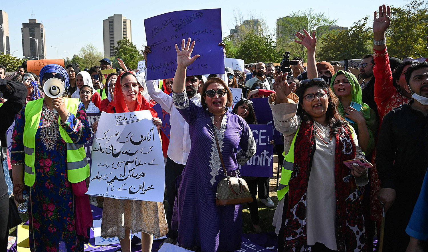Activists of Aurat (women) March hold placards as chant slogans during a demonstration rally to mark the International Women's Day in Islamabad on March 8, 2023. (AFP)
