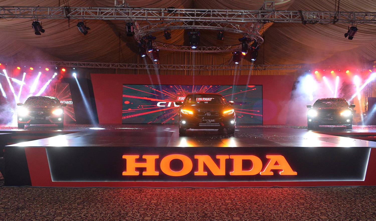 Honda Civic cars are seen on display at the launch event Honda Atlas Cars (Pakistan) Limited at the Royal Palm Golf & Country Club in Lahore on April 14, 2019. (Photo courtesy: @hacpl/Facebook)