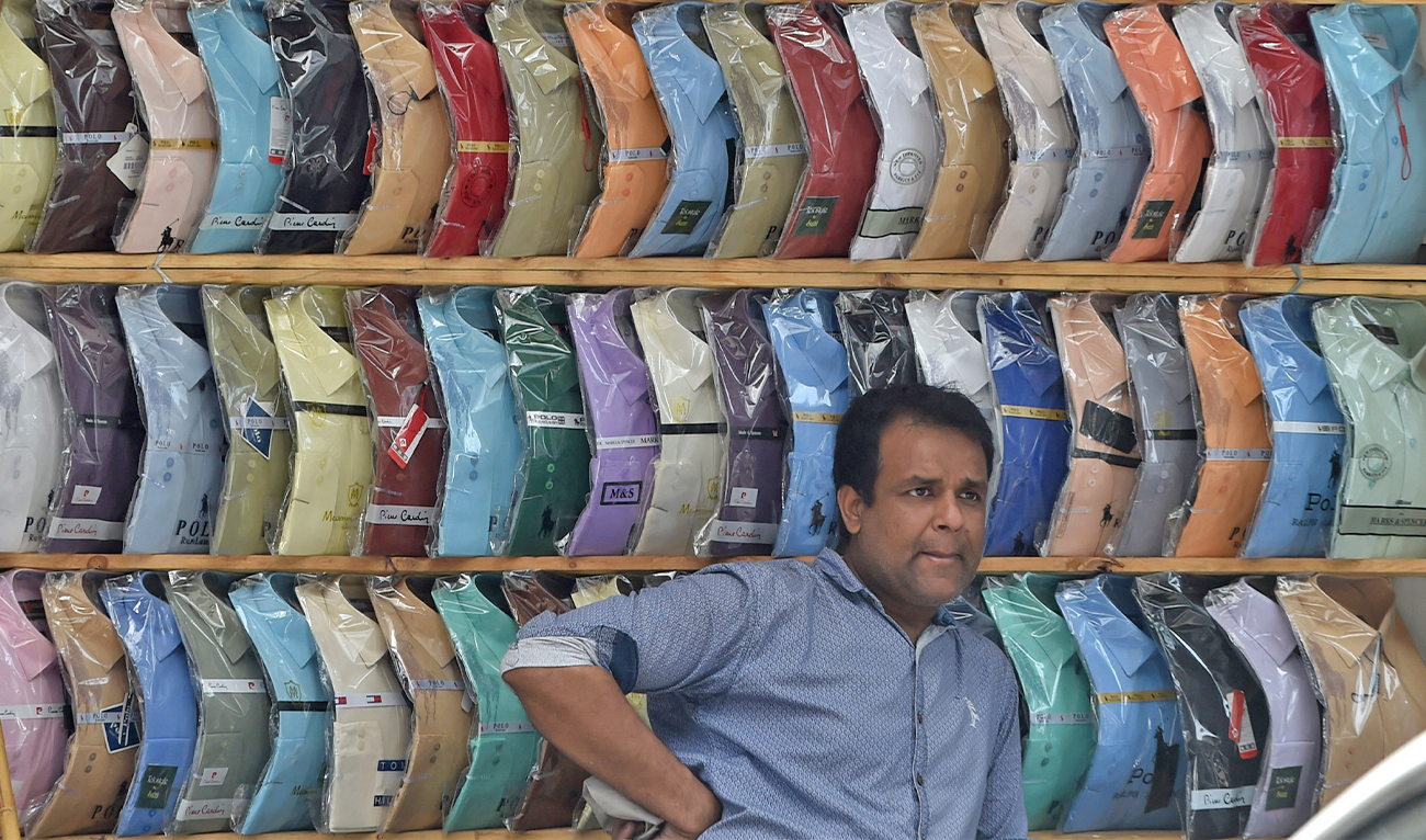 A shopkeeper waits for customers in a market in Lahore, Pakistan, on May 11, 2020. (AFP/File)