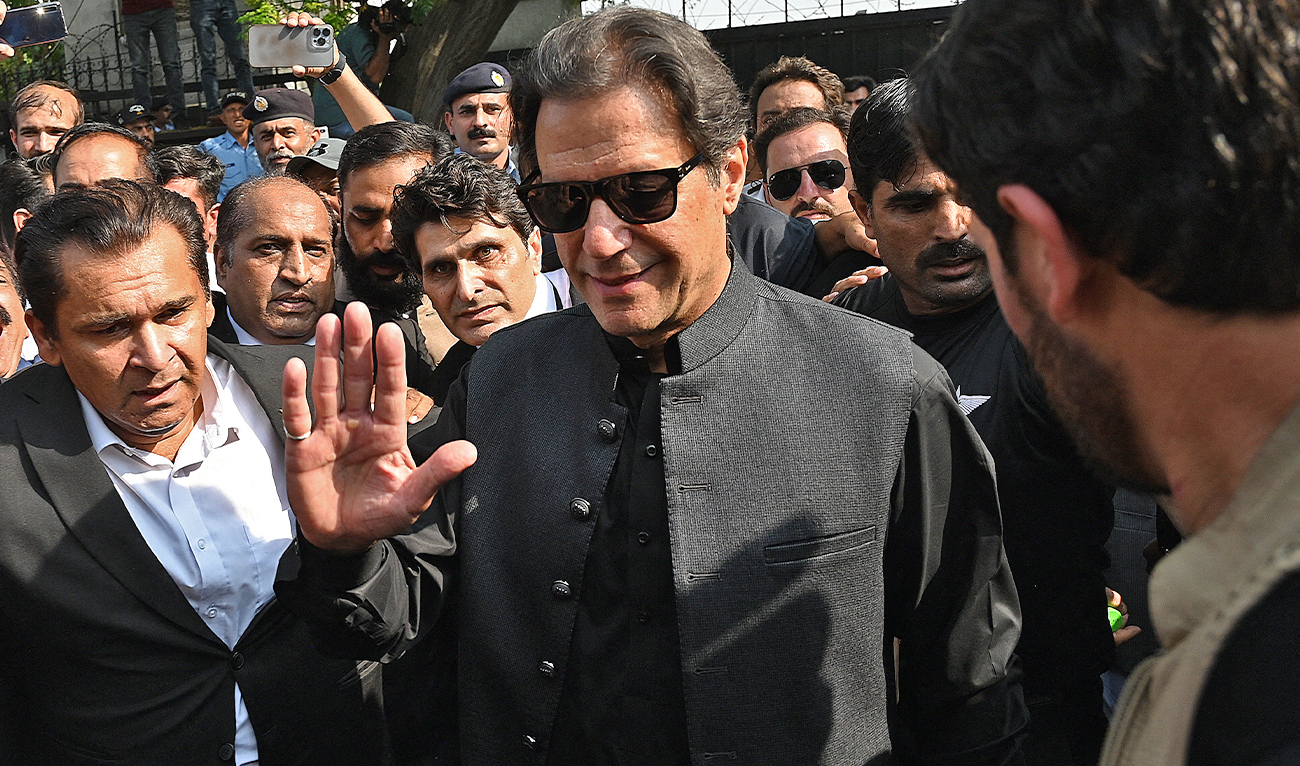 Pakistan's former Prime Minister Imran Khan (C) gestures as he leaves after appearing before the High Court in Islamabad on September 22, 2022. (AFP/File)