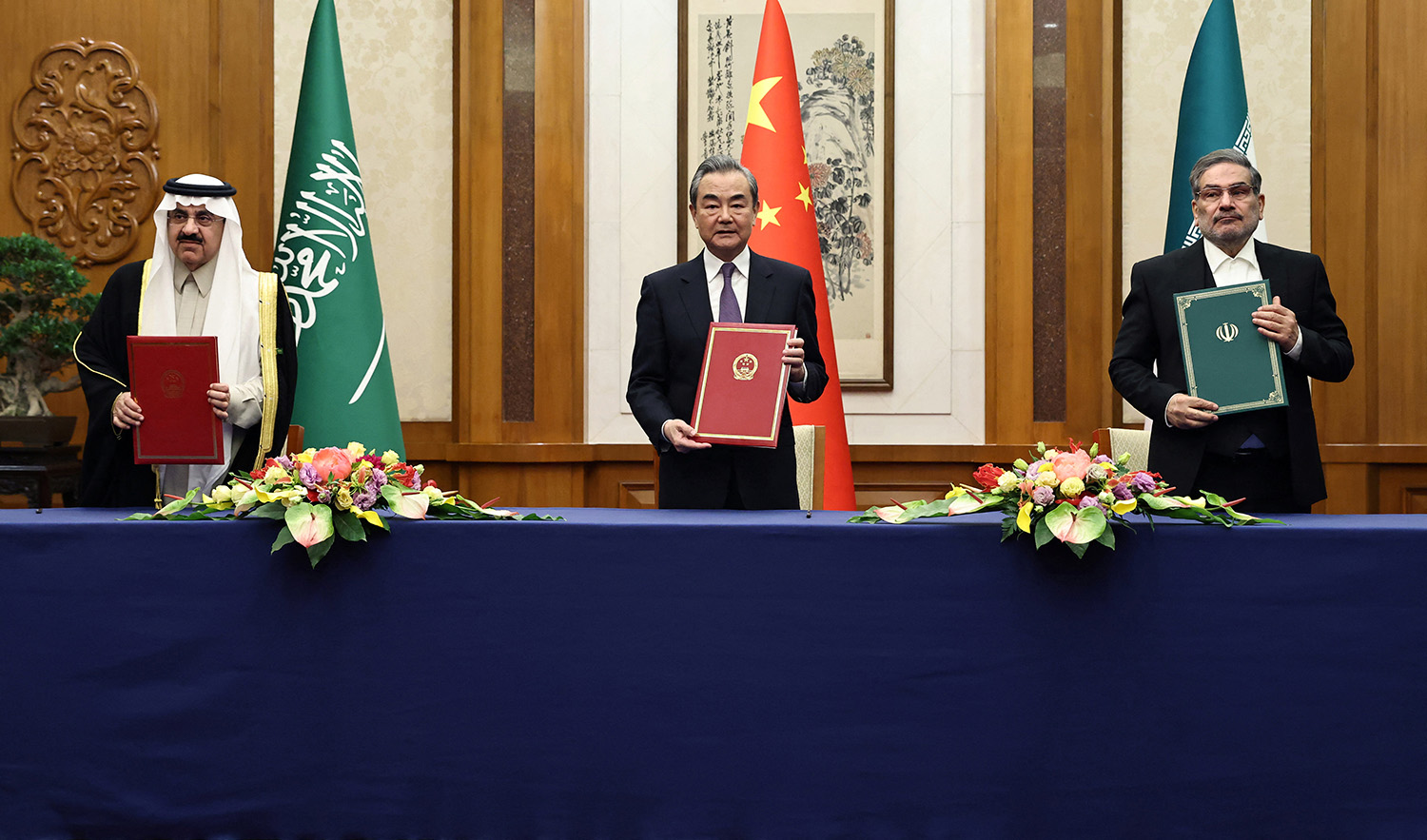 Director of China's Office of the Central Foreign Affairs Commission, Wang Yi, center, attends a meeting with Secretary of Iran's Supreme National Security Council Ali Shamkhani, right, and Minister of State and national security adviser of Saudi Arabia Musaad bin Mohammed Al Aiban in Beijing, China on March 10, 2023. (China Daily via REUTERS)