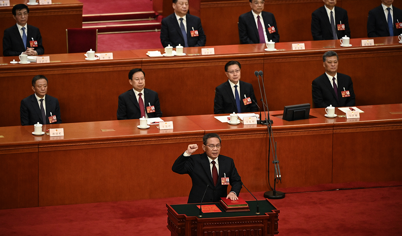 China's newly-elected Premier Li Qiang takes an oath after being elected during the fourth plenary session of the National People's Congress (NPC) at the Great Hall of the People in Beijing on March 11, 2023. (Photo courtesy: AFP)