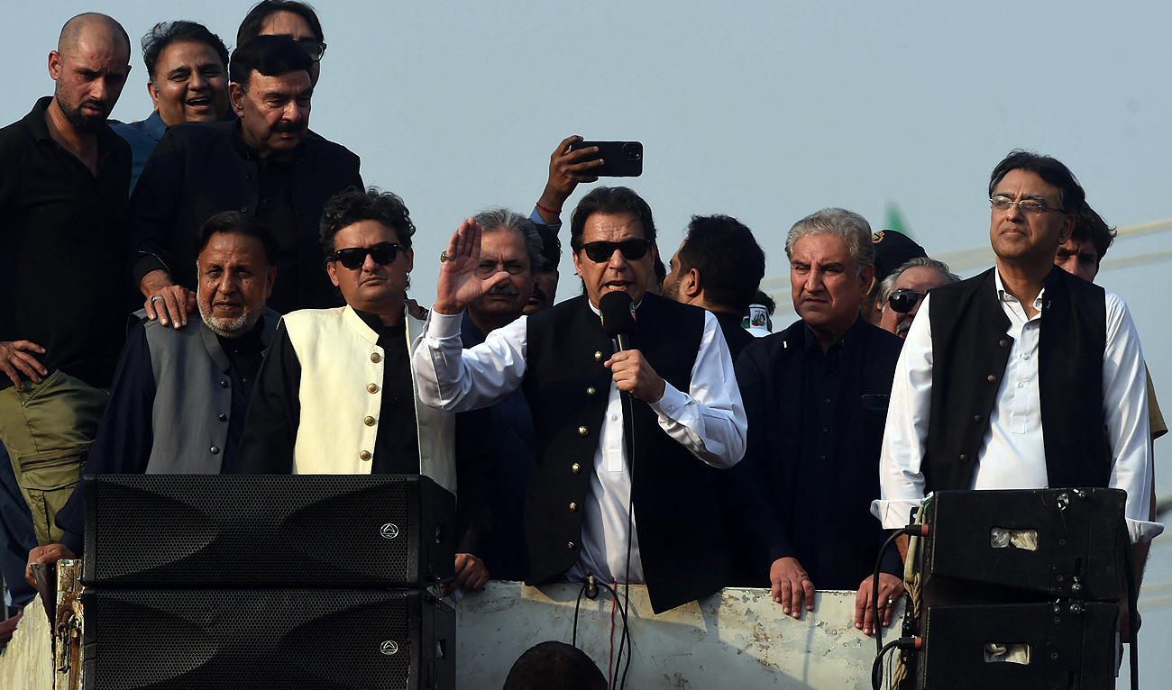 In this file photo, taken on October 28, 2022, former Pakistan prime minister Imran Khan (C) addresses his supporters during an anti-government long march in Lahore. (Photo courtesy: AFP/File)