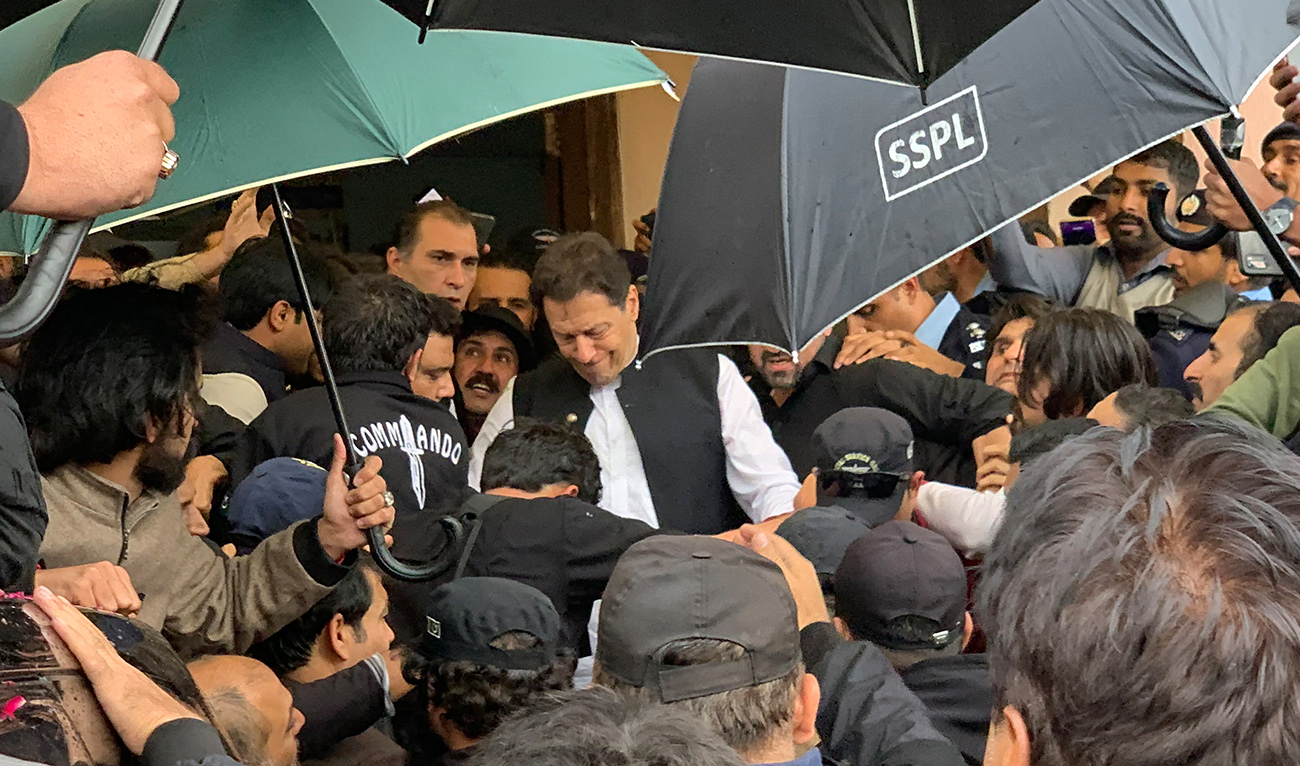 Pakistan's former Prime Minister Imran Khan (C) leaves after appearing at the court in Islamabad on February 28, 2023.