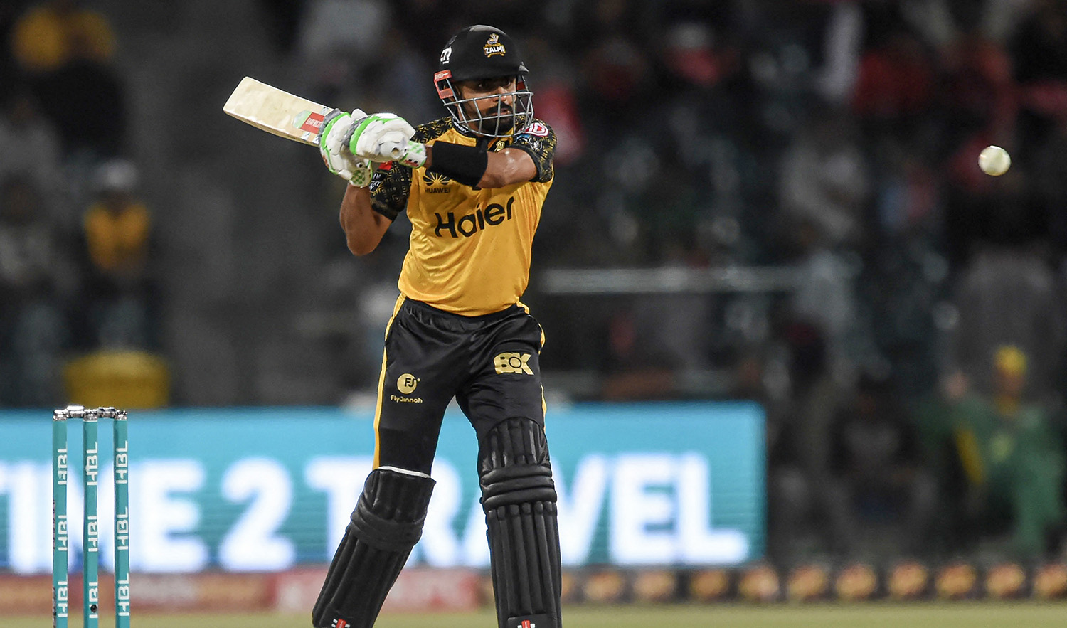 Peshawar Zalmi's Babar Azam plays a shot during the Pakistan Super League (PSL) Twenty20 cricket eliminator match between Peshawar Zalmi and Islamabad United at the Gaddafi Cricket Stadium in Lahore on March 16, 2023. (AFP)