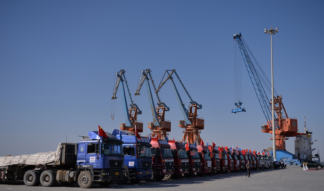 Chinese trucks stand on a pontoon during the opening of a trade project in Gwadar port, some 700 kms west of the Pakistani city of Karachi on November 13, 2016. (AFP/FILE)