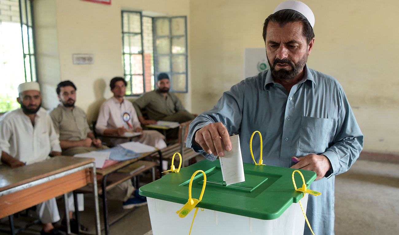 In this file photo, taken on July 20, 2019, a tribesman ballot casts his vote in a polling station for the first provincial elections in Jamrud, a town of the Khyber Pakhtunkhwa province. (Photo courtesy: AFP/File)