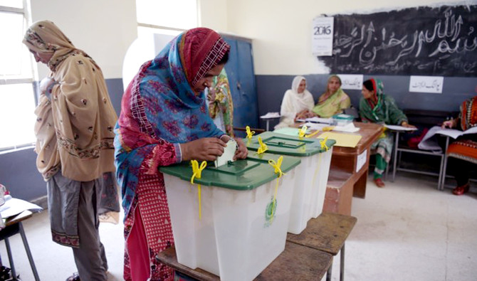 A woman casts her vote during Pakistan's general election at a polling station in Islamabad on July 25, 2018. (AFP/file)
