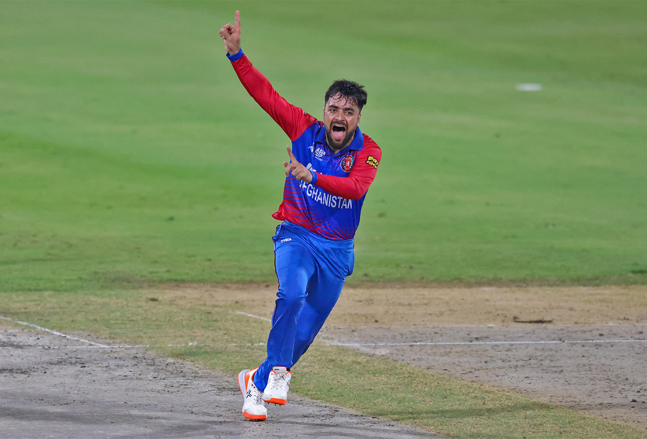 Afghanistan's Rashid Khan celebrates after dismissing Pakistan's Mohammad Rizwan (not pictured) during the Asia Cup Twenty20 international cricket Super Four match between Afghanistan and Pakistan at the Sharjah Cricket Stadium in Sharjah, UAE, on September 7, 2022. (AFP/File)