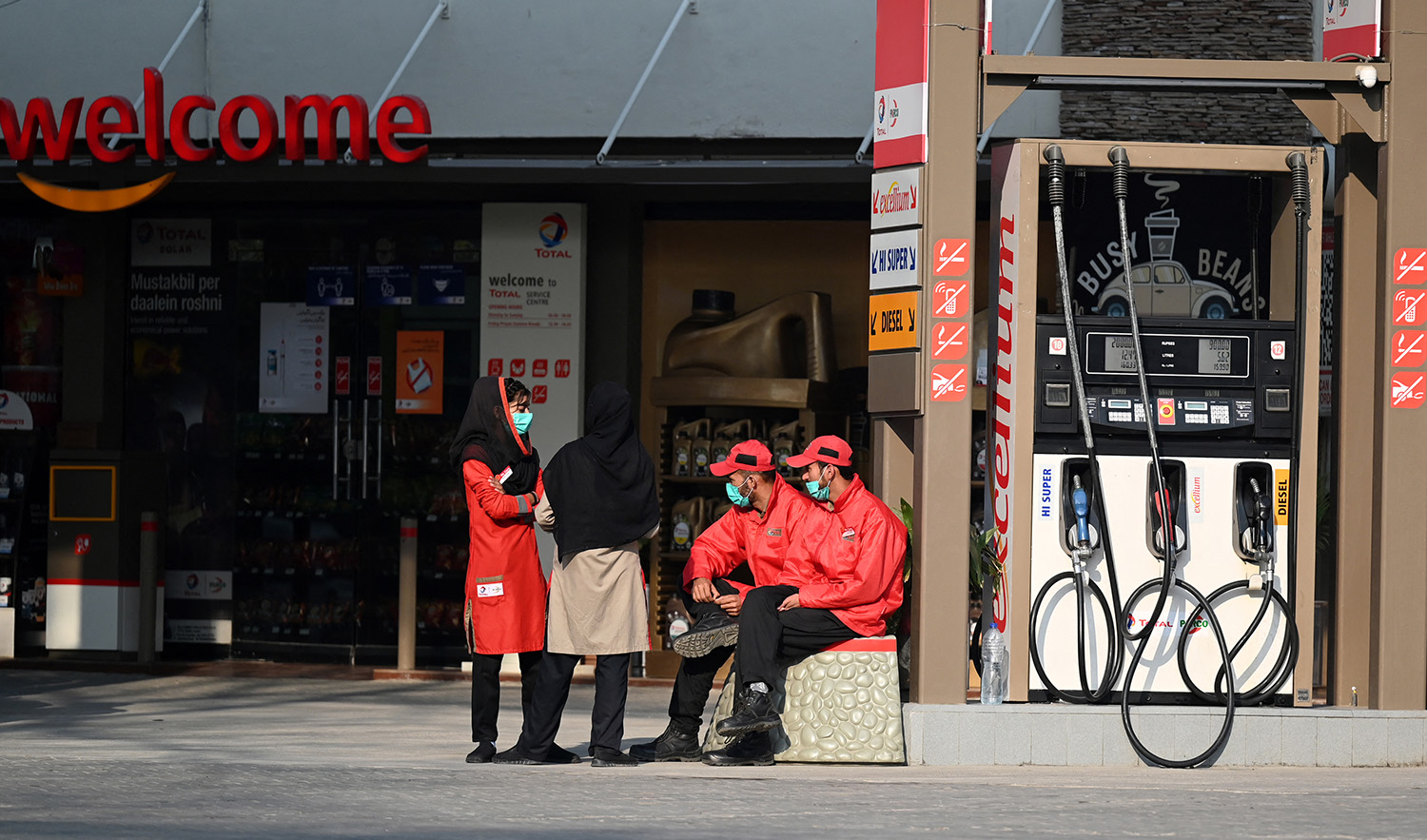 Employees at a fuel station wait for customers in Islamabad, Pakistan on February 16, 2022, after a hike in prices of petroleum products. (AFP/File)