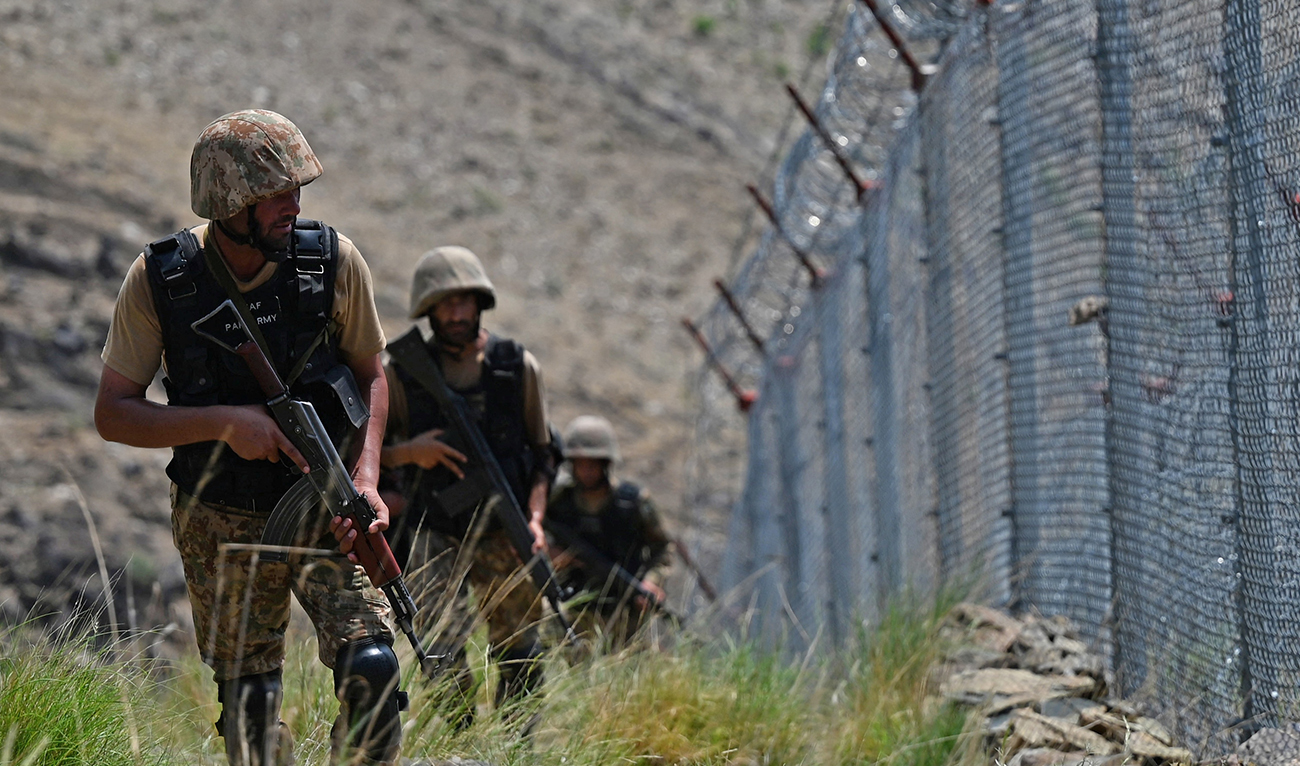Pakistani troops patrol along Pakistan-Afghanistan border fence at Big Ben post in the Khyber district of the Khyber Pakhtunkhwa province on August 3, 2021. (AFP/FILE)