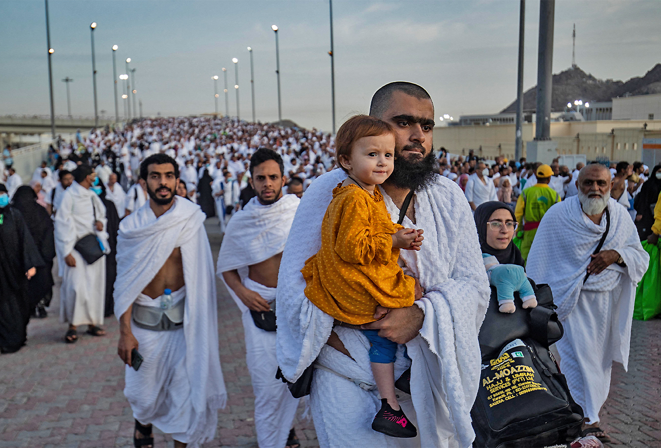 Thousands of Muslim pilgrims make their way across the valley of Mina, in western Saudi Arabia, to perform the "stoning of the devil" ritual on July 9, 2022. (AFP/File)