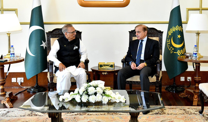 This handout picture, taken on September 28, 2022, shows Pakistan Prime Minister Shehbaz Sharif meeting President Dr. Arif Alvi at the Presidential Palace in Islamabad. (Photo courtesy: Twitter/PresOfPakistan)
